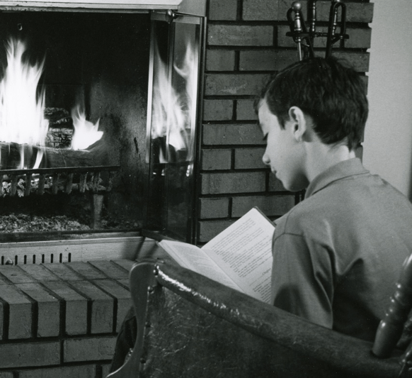 kid by fireplace